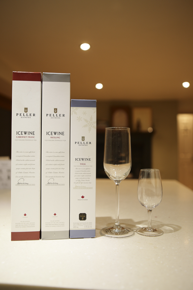 Photo of boxes for Canadian ice wine alongside two glasses of wine.