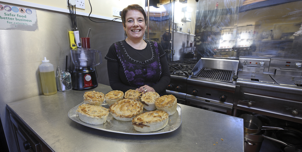 Maria, Landlady at The Rising Sun, Woolaston Common, in the kitchen standing over her homemade pies