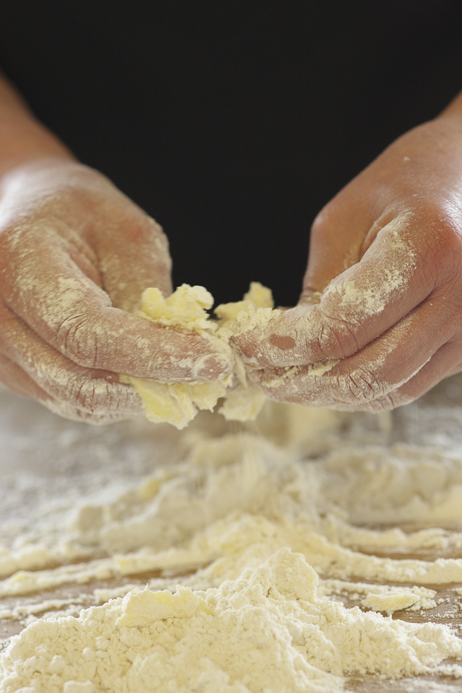 A close up picture of Yvette's hands whilst she makes the dough for her Forest Flatbreads
