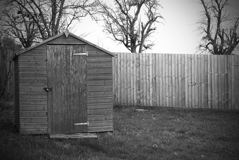A black and white photo of the shed that houses the wellhead at Hillside Brewery in Longhope, Forest of Dean.